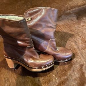 UGG fur-lined leather boots with a wooded sole